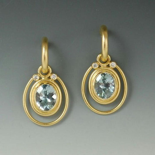 Golden vintage earrings with blue crystal inlay Unique Joyas