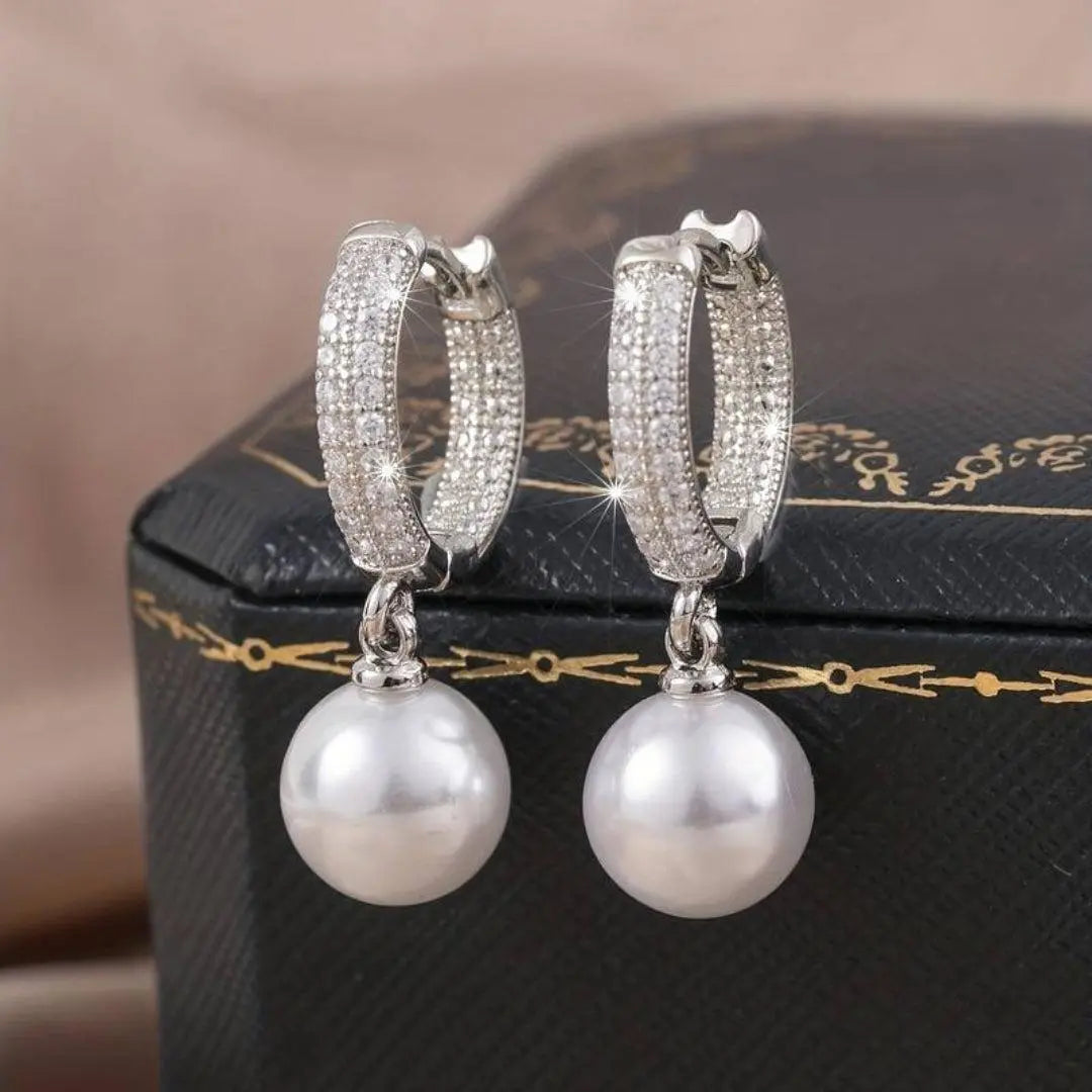 Elegant earrings with shiny pearls in silver Unique Joyas