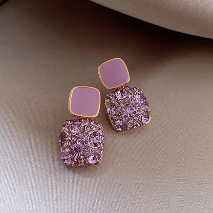 Luxurious purple earrings with zirconia inlay