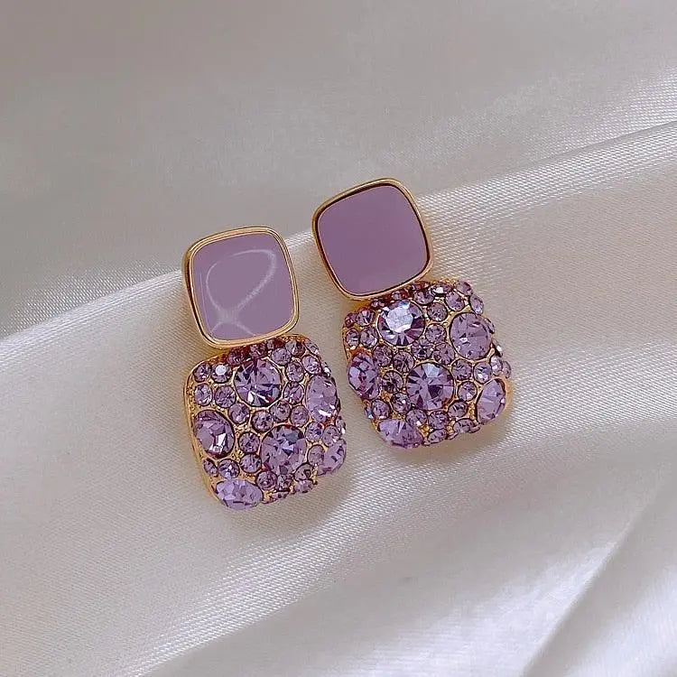 Luxurious purple earrings with zirconia inlay