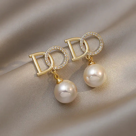 Elegant drop earrings with pearl and crystal accents Unique Joyas