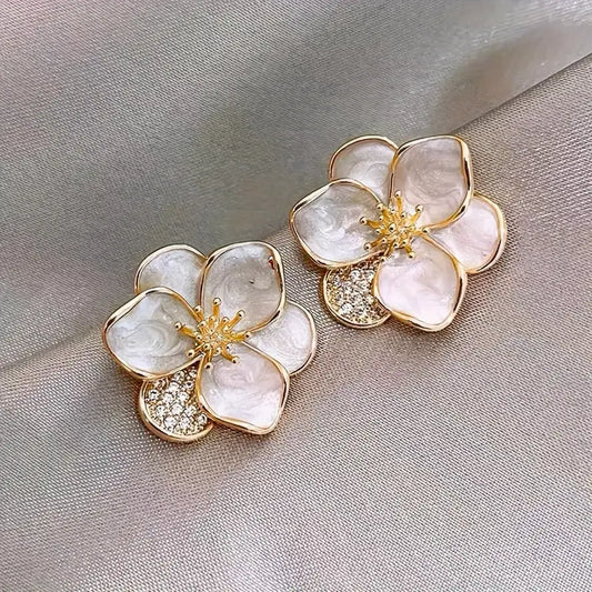 Delicate silver earrings with floral accents