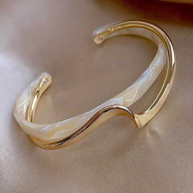 Gold plated wave-shaped bangle