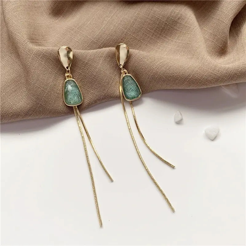 Gold earrings with turquoise stone Unique Joyas