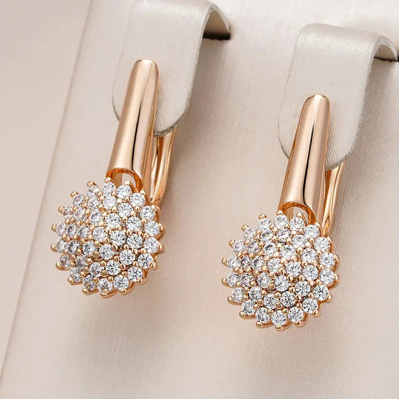 Elegant zirconium flower earrings in gold Unique Joyas