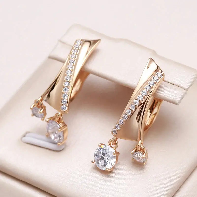 Elegant earrings with white crystal in gold Unique Joyas