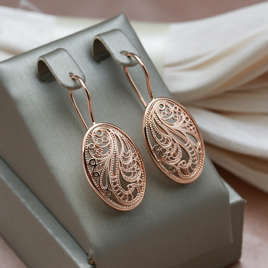 Elegant shiny earrings in gold Unique Joyas