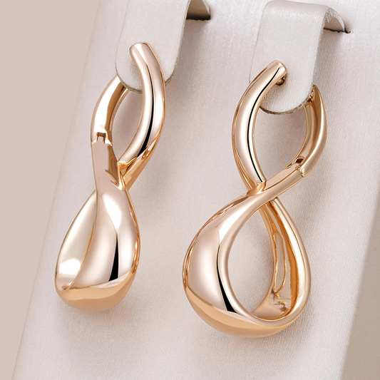 Gold-colored wavy earrings Unique Joyas