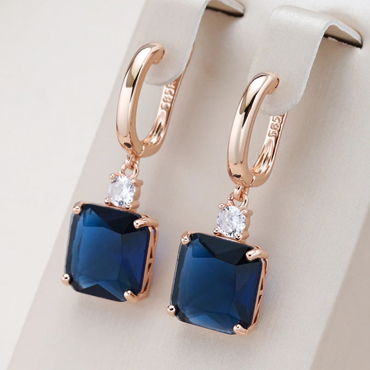 Elegant earrings with dark blue crystal in gold Unique Joyas