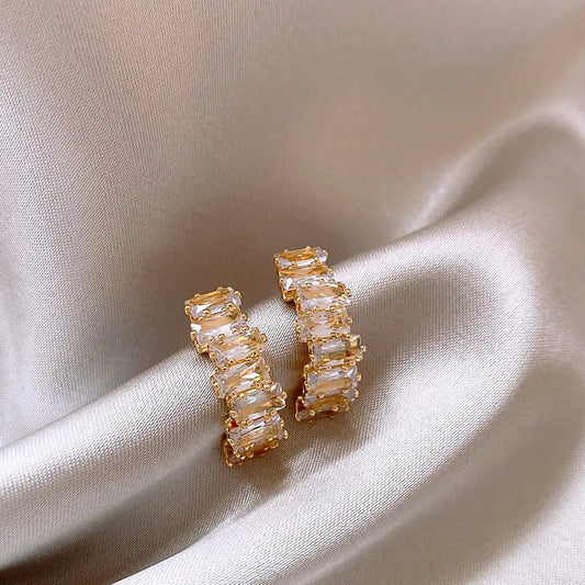 Elegant earrings with zirconium crust in gold