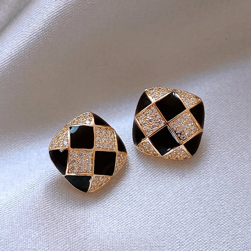 Shiny elegant earrings made of black enamel