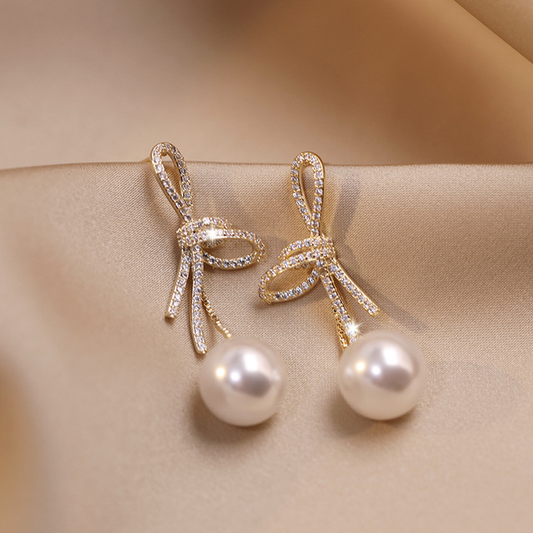 Gold Pearl Earrings with Shiny Bow Unique Joyas