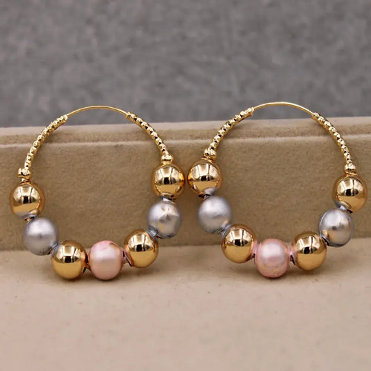 Golden earrings with vintage beads Unique Joyas