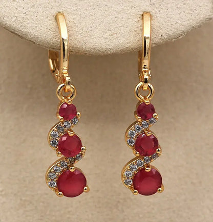 Elegant earrings with golden zirconia Unique Joyas