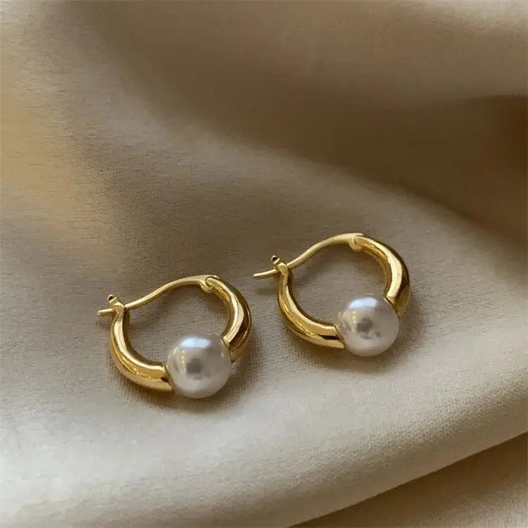 Elegant gold pearl earrings Unique Joyas