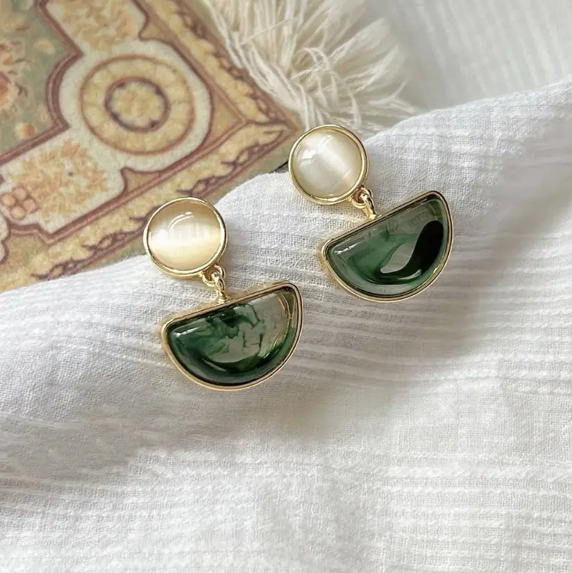 Elegant earrings made of green polished stone