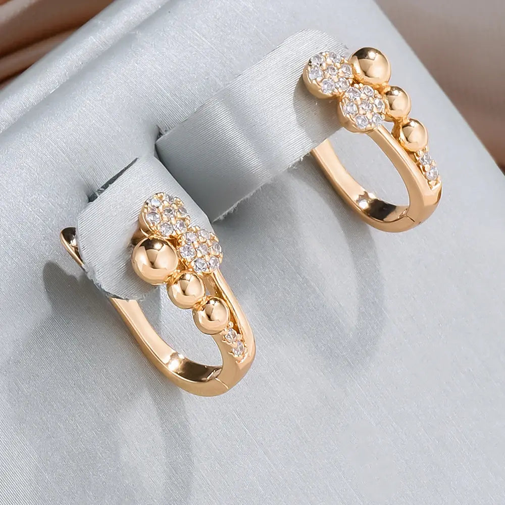 Elegant gold earrings with bright dots Unique Joyas