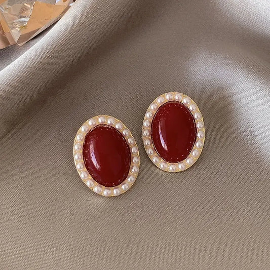 Elegant oval earrings in gold and red Unique Joyas