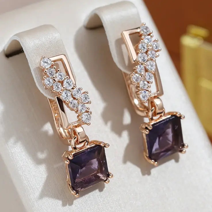 Earrings with elegant gold-plated dark crystals