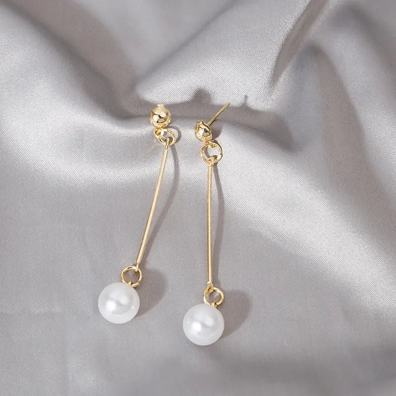 Luxurious dangling earrings with special hand-placed pearls Unique Joyas