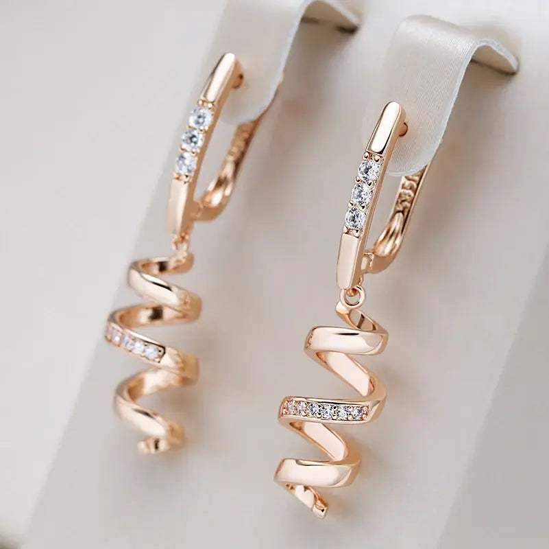 Elegant spiral earrings with zirconia in gold Unique Joyas