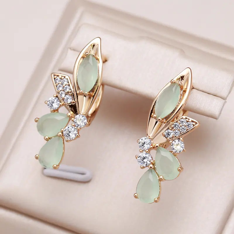 Elegant Green Crystal Winged Earrings in Gold Unique Joyas